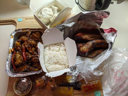 Takeout: orange beef dinner entree w/white rice, steamed dumplings, spare ribs