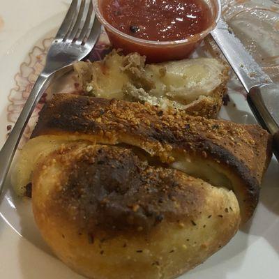 Meatball calzone with marinara sauce