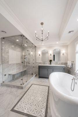 Steam shower, bath tub, and a double vanity set.  Custom tile work