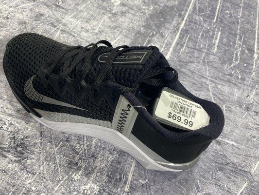 Nike Metcon's - black, white, and silver. zoom in and look at the tag.....tag is on the the wrong shoe!