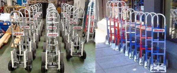 Rows of custom-built aluminum hand trucks. Stocked here in Portland. You pick the parts you want and we build it up. Great for movers!!