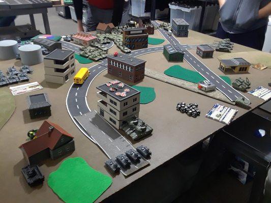 View from the British, missile-launching tank killers bar the road and Marksman AA vehicles wait behind a tall apartment tower