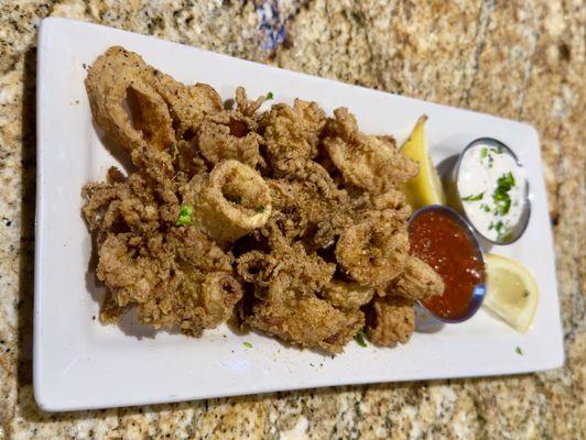 Huge portion of Calamari, gently Cajun seasoned and comes with delicious dipping sides!