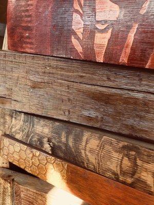 Barrel stave artwork on the tasting room counter.