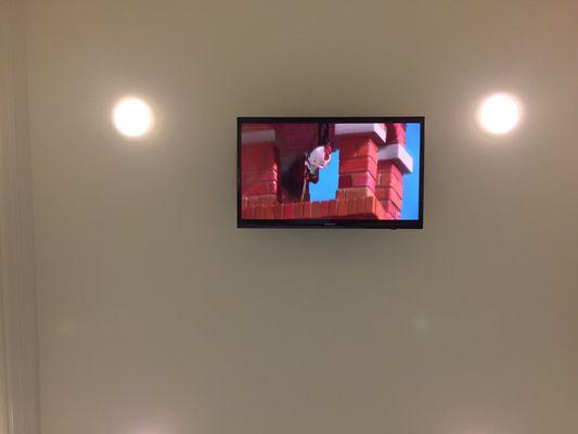 Overhead TV playing Chicken Little during procedures