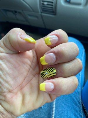 Yellow French tip acrylic nail fill with custom design