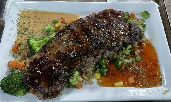 General Tao's Steak with fried rice and steamed vegetables.