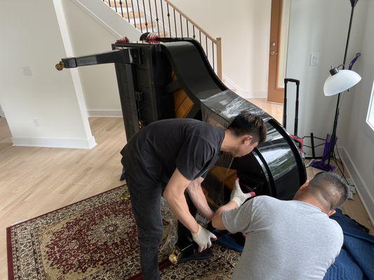 Assembling legs for the grand piano