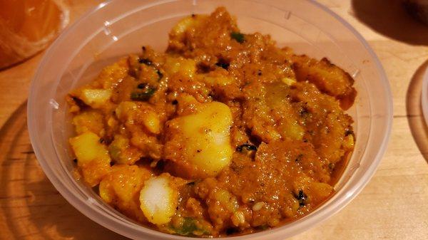 Potato achaar ($5). Vegan by default and decent, but not amazing. Slightly salty & vinegar-y.