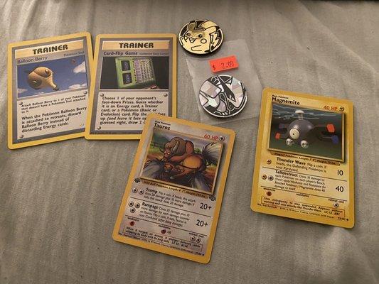 1st edition Tauros and many other cards. Bought some Pokémon medals as well!