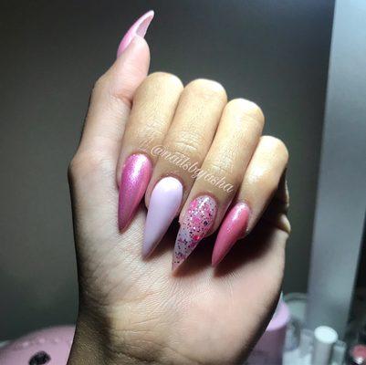 Multi gel polish pink tones and acrylic stiletto nails