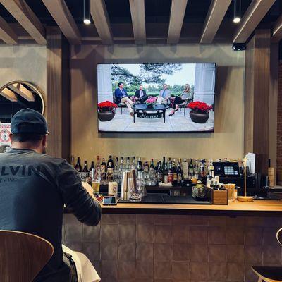 TVs and full bar with a large selection of sake and rare whiskey