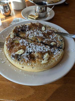 Their Ipswich House special pancake with blueberries bananas almonds and pecans, ordered with their real maple syrup.