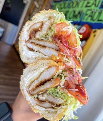 Chicken cutlet hoagie with breaded chicken cutlet, your choice of cheese, lettuce, tomato, raw onion, Mayo oil vinegar