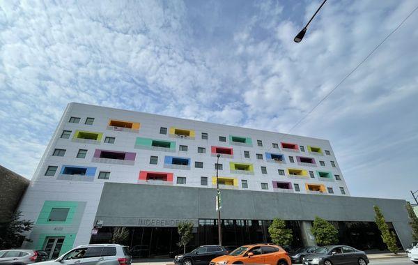 The library is the more muted part of the building, whilst the CHA housing is more colorful.