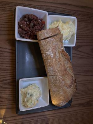 Baguette bread with butters and an olive something that we didn't try.  Garlic butter was delicious.