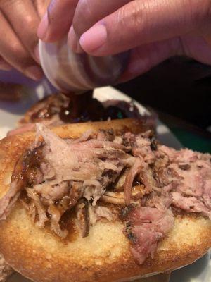 My Husband's embarrassing pulled pork sandwich. Tiny & dry. He had to ask for more bbq sauce. Limited amount of pork meat, so sad.