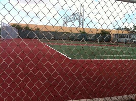 Tennis courts are next to turnpike