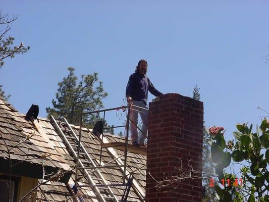 Relining a chimney for a wood burning stove.