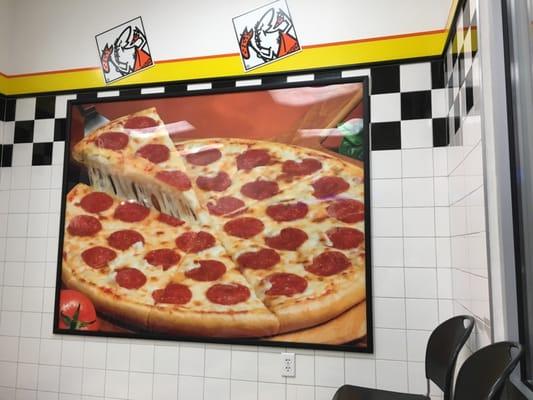 The large pizza on the wall will get your appetite going, fo sho.