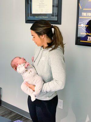 Dr. Leilani checking a practice member after the birthing process.