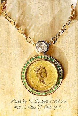 24-Carat Gold Coin necklace with green emeralds and a round brilliant cut diamond!