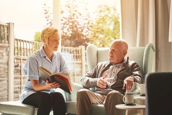 "Compassionate Care: A Caregiver Engages in Meaningful Conversation with a Senior"