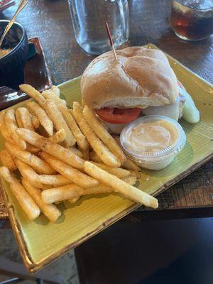 Grilled chicken sandwich with mozzarella cheese, side of fries.