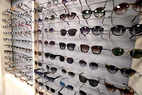 Frame lines include Tom Ford, Prada, Barton Perreira, Ray Ban, La Font, Silhouette, etc.