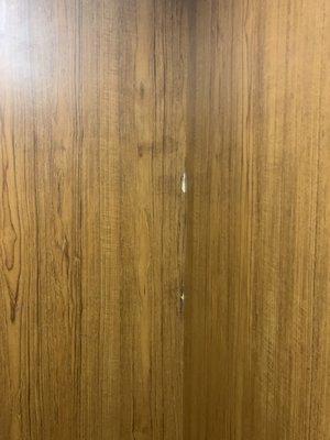 Elevator wall looks chipped.