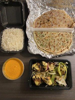 Tandoori ginger chicken, onion kulcha, coriander Naan, rice, and Curry sauce