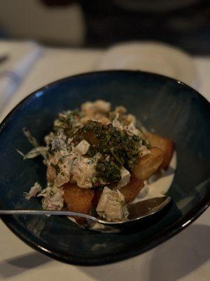 Fried potatoes with house smoked salmon, creme fraiche and coriander salsa verde