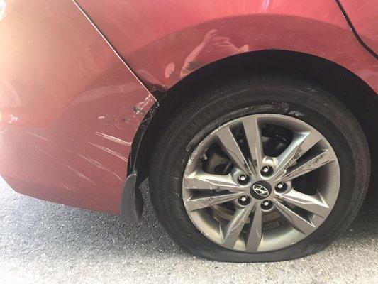 My car after being hit by an Express Towing Truck. (Kind of ironic since they're a towing company).