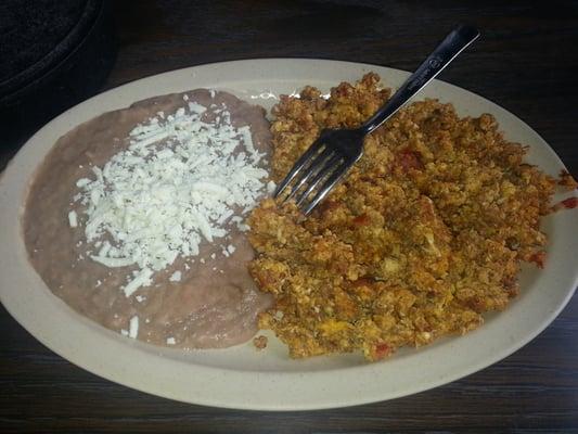 Chorizo and Egg served with a side of refried beans.