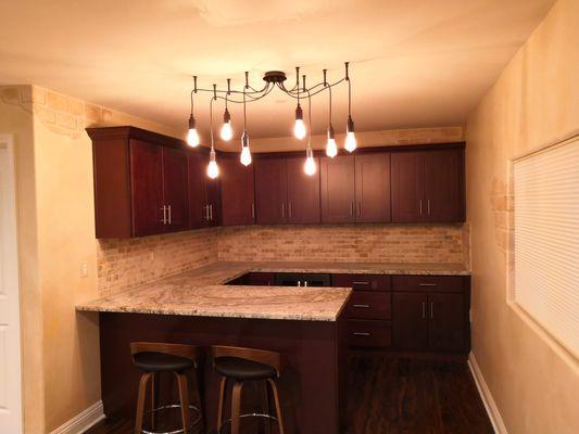 espresso cabinets and granite top for bar