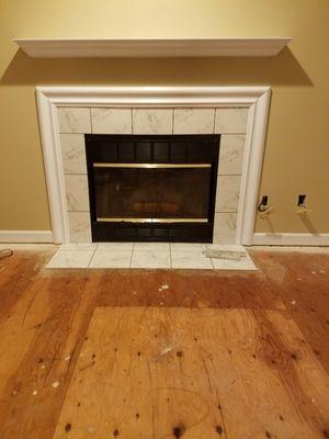 Before picture of a fireplace renovation.