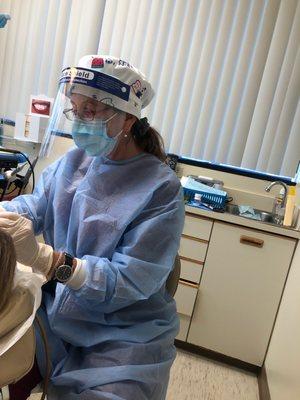 Dental assistant with proper equipment!