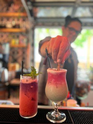 Bartender finishing up our cocktails