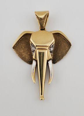 A 9k yellow gold art deco style elephant pendant. We are San Diego's highest rated gold and jewelry buyers.