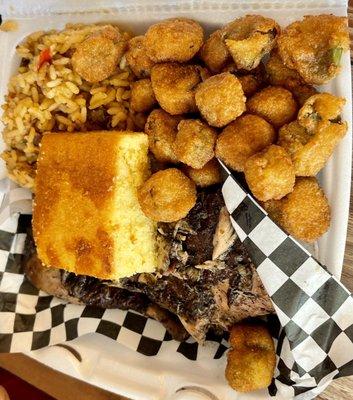 Jerk chicken with dirty rice, okra, and cornbread