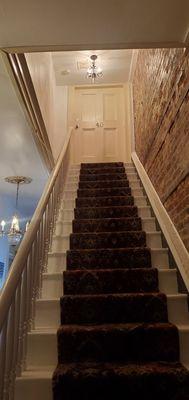 Stairs leading to the loft room.