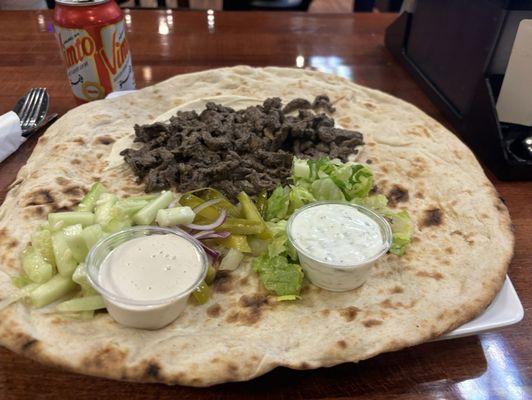 Beef shawarma hummus and Iraqi bread.