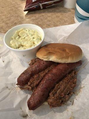 Chopped brisket and sausage sandwich with potato salad