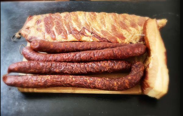 CW from top: smoked spare ribs (füstölt oldalas), Mangalica bacon (szalonna), semi dried smoked sausages (puha házi füstölt kolbász)