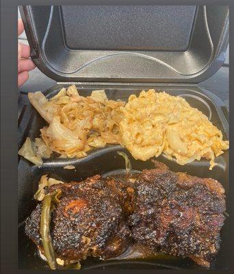 Smoked oxtail plate with smoked cabbage and jalapeno cheese grits.