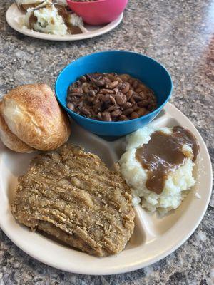 Country fried steak, mashed potatoes and pinto beans.