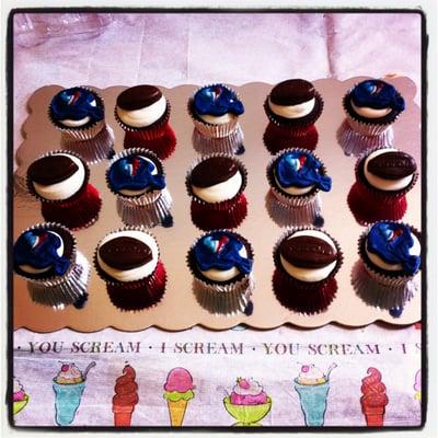 Chocolate cupcakes with custom Houston Texans fondant toppers.