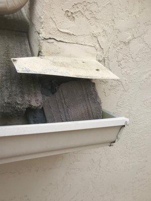 broken tile in gutter