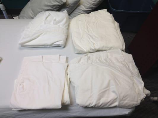 "Wash and Fold" service with minimal folding.  This is how my professionally folded top sheets were returned to me.