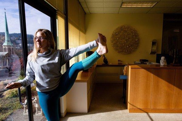 Yoga in an office setting. Photo by Dal Perry